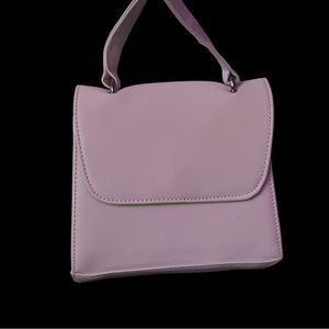 Super cute, hand, held or over the shoulder bag!